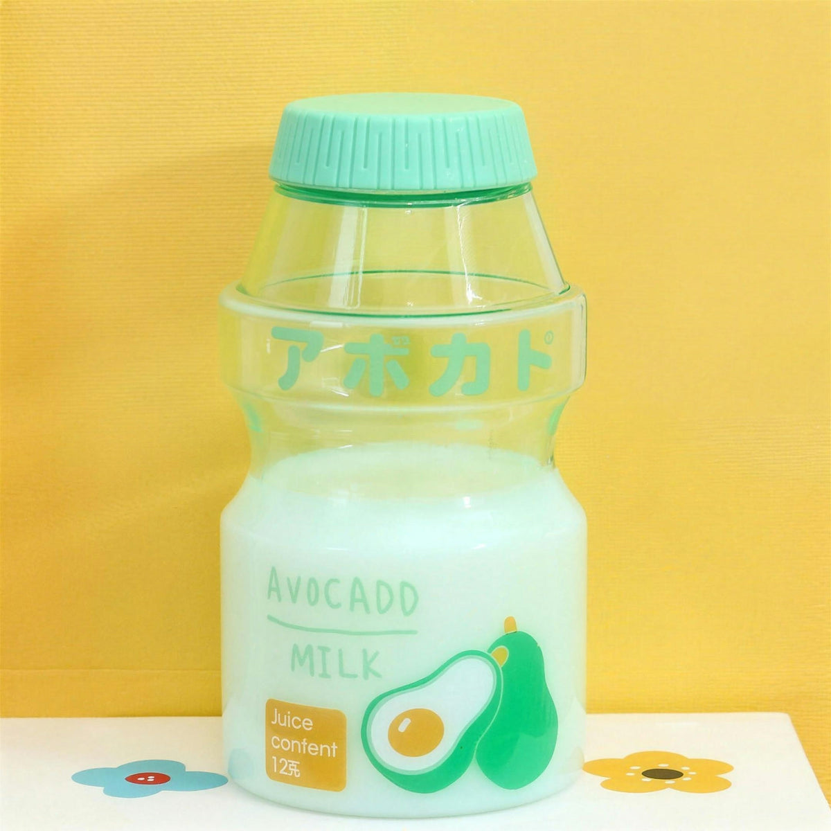Clear avocado fruit milk water bottle with green lid