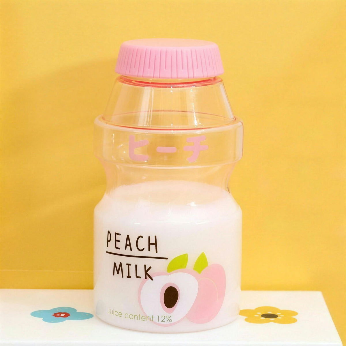 Clear peach fruit milk water bottle with pink lid