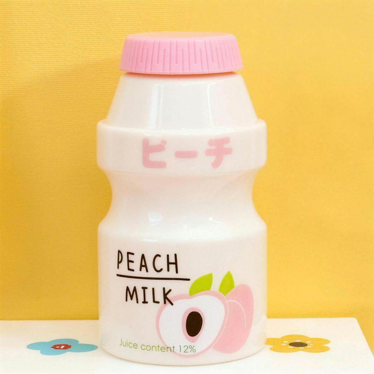 Opaque peach fruit milk water bottle with pink lid