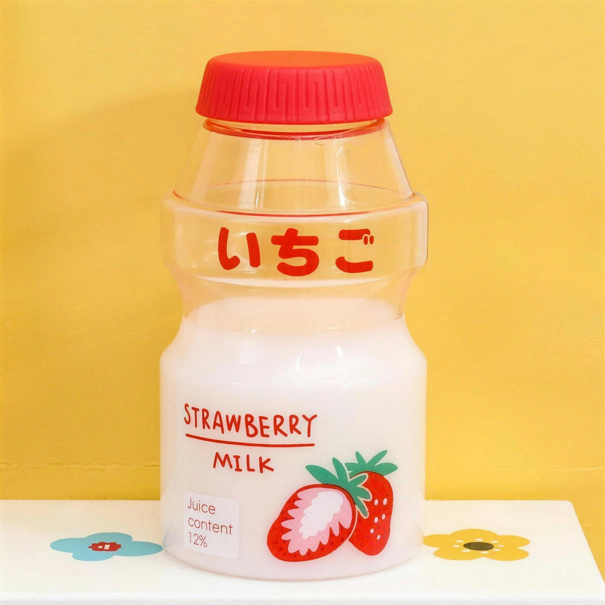 Clear strawberry fruit milk water bottle with red lid