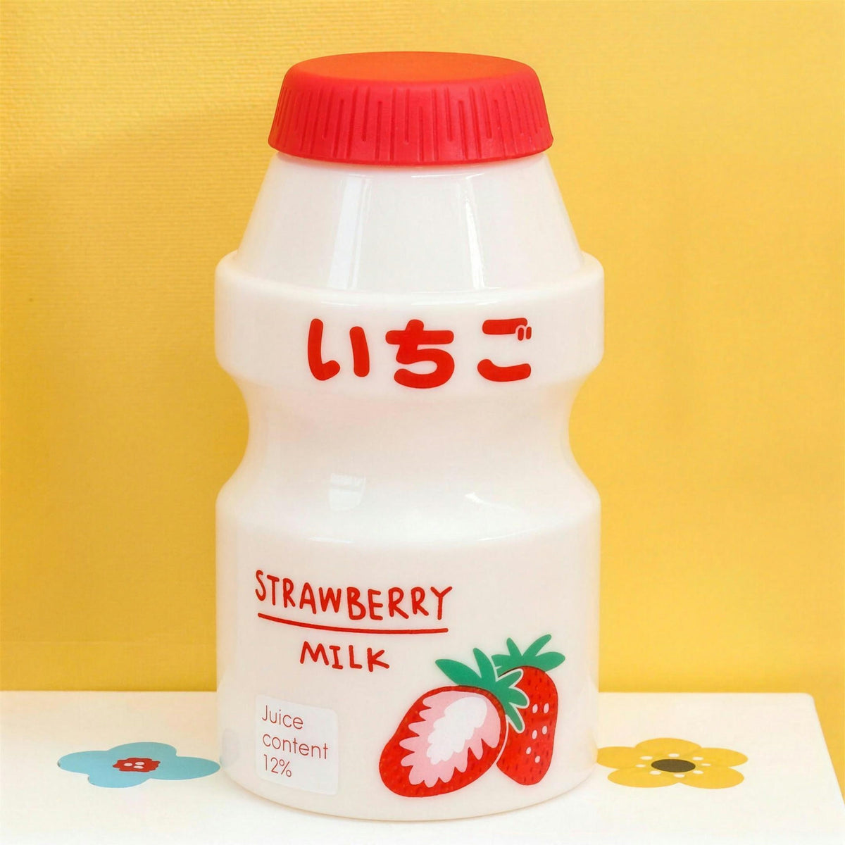 Opaque strawberry fruit milk water bottle with red lid