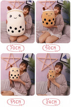 Boba Plush Pillow sizes held by a model: about 28, 20, 14 and 9 inches tall (70, 50, 35 and 24 cm)