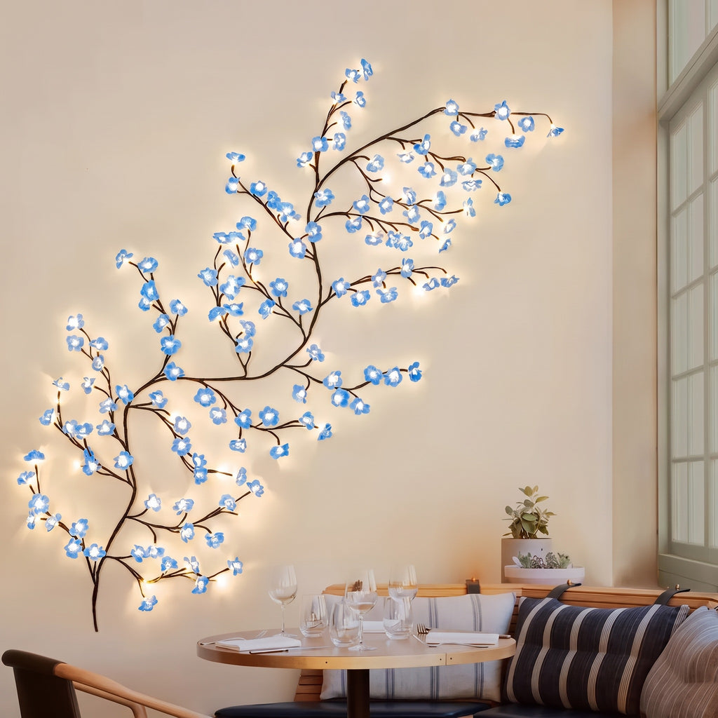 Blue Cherry Blossom Branch Light on the wall of a dining nook