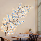 Blue Cherry Blossom Branch Light on the wall of a dining nook