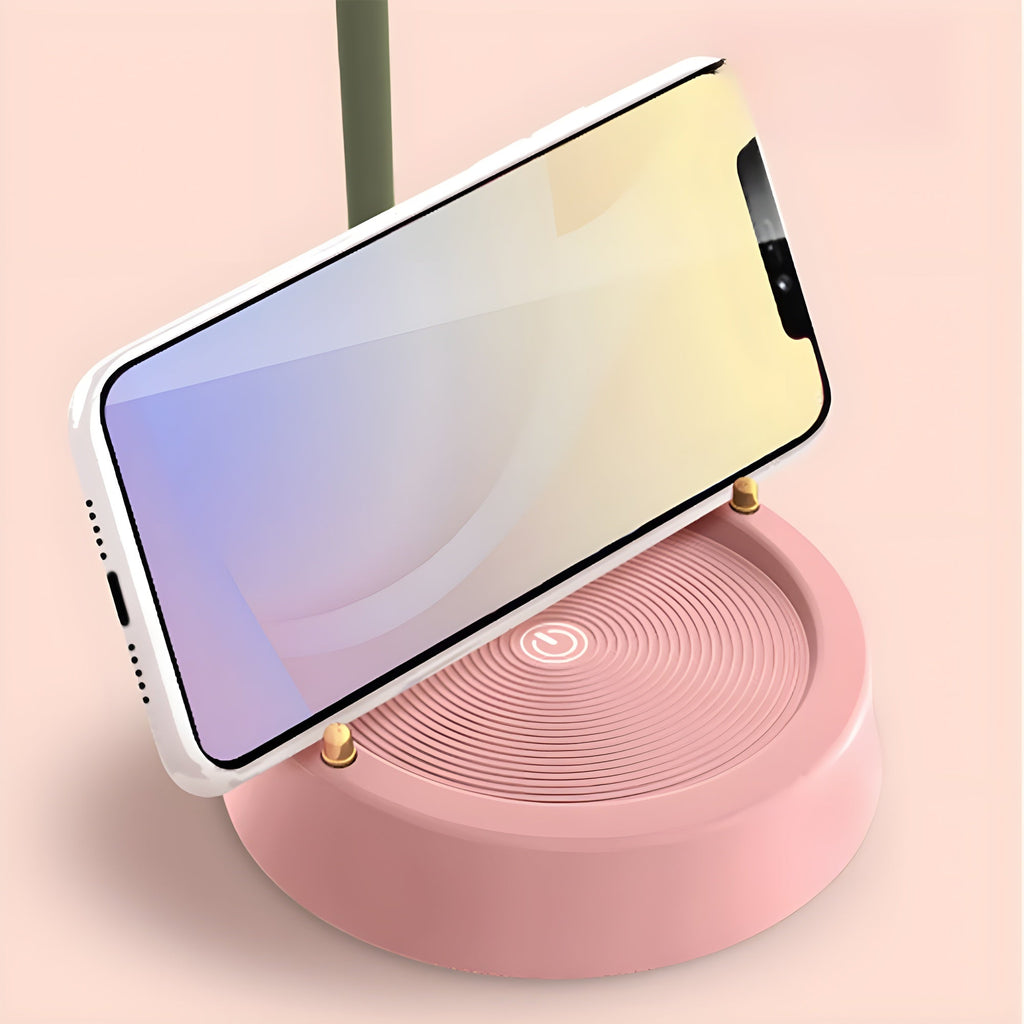 Smartphone standing in landscape in the lamp base's built-in phone holder groove