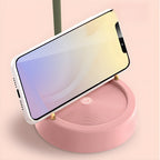 Smartphone standing in landscape in the lamp base's built-in phone holder groove