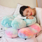 Model resting on a stack of fluffy tie-dye Flower Plush Pillows