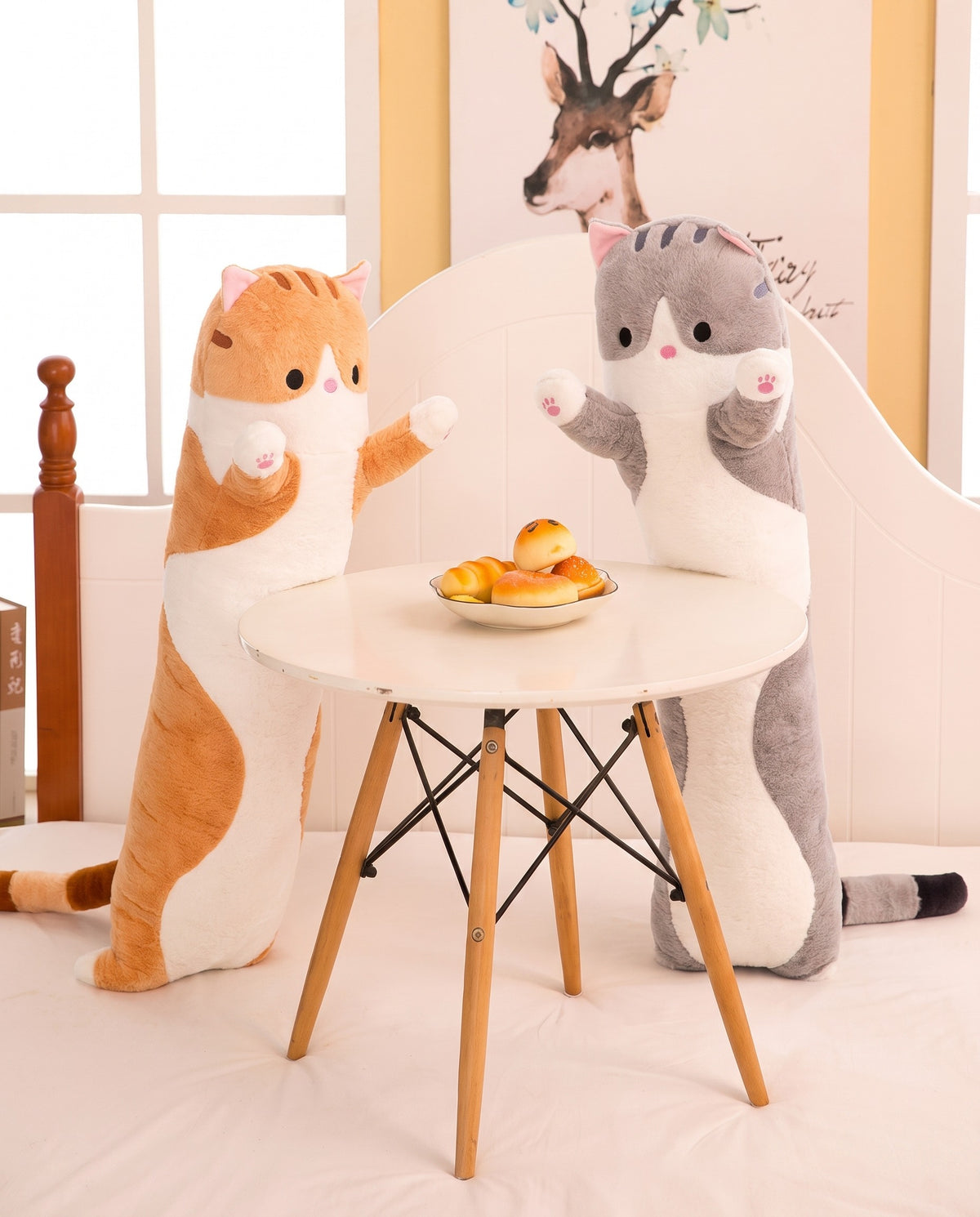 Orange Long Cat Plush Pillow standing beside a small round table