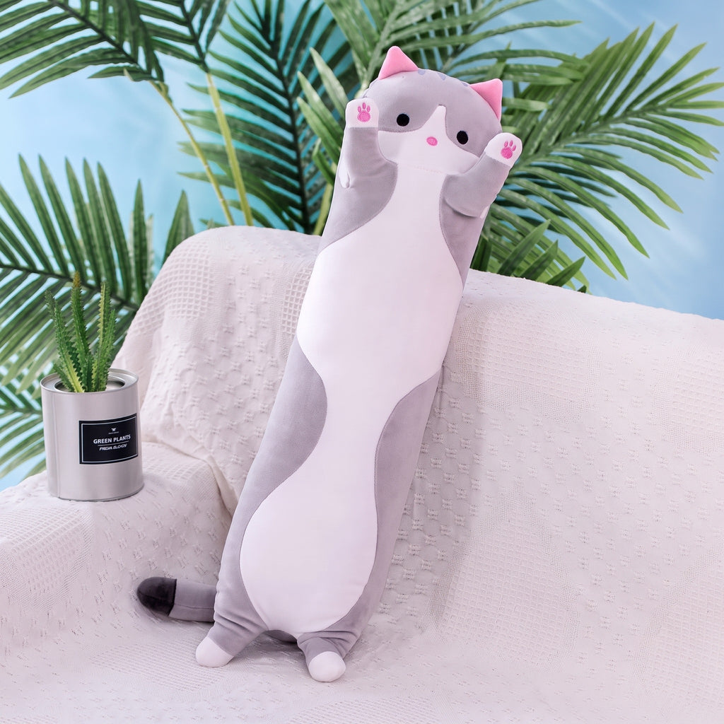 Long Cat Plush Pillow in grey, a slim plush cat with a white belly and raised paws, standing on a sofa