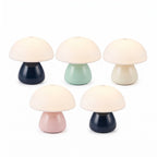 Five mini mushroom lamps unlit on a white background