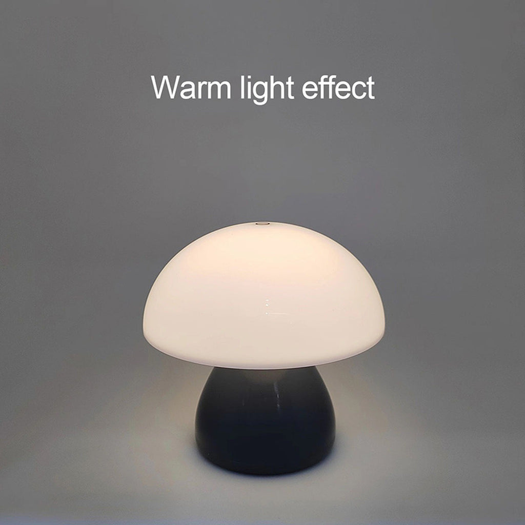 The Mini Mushroom Touch Lamp lit warm