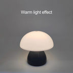 The Mini Mushroom Touch Lamp lit warm