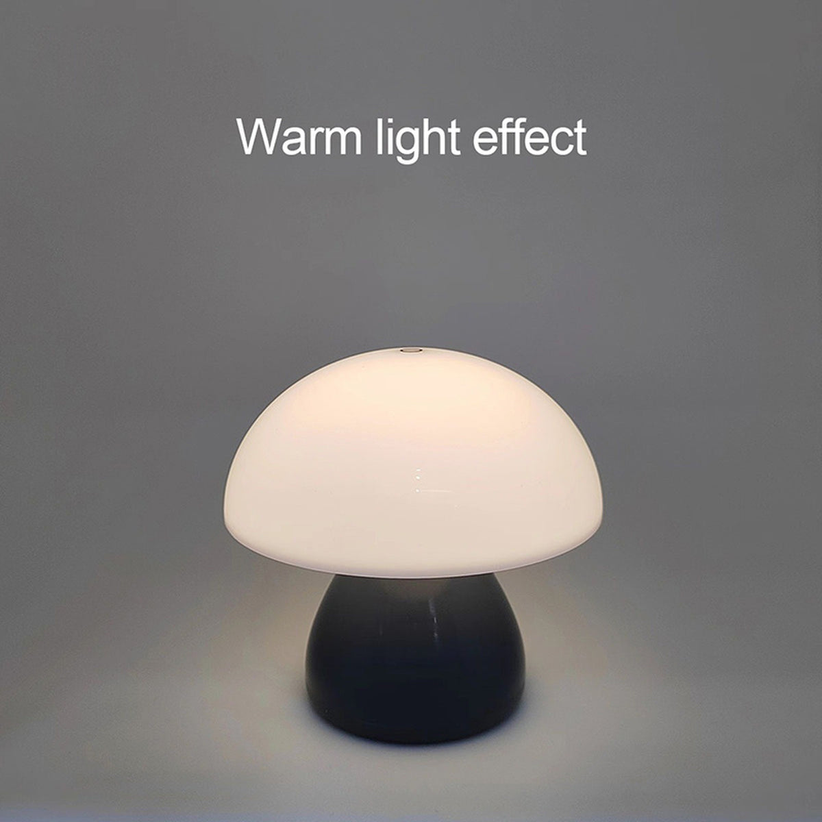 The Mini Mushroom Touch Lamp lit warm