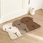 Puppy Trio Bath Mat on a wood floor by a door