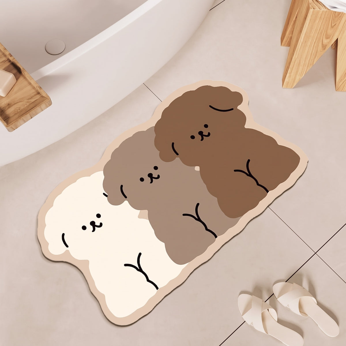 Puppy Trio Bath Mat by a bathtub, angled view, with a pair of slippers
