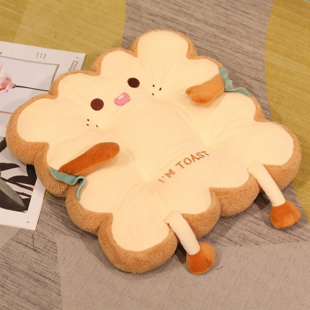 Toast Seat Cushion, Cheeky face with its tongue poking out, lying on a rug