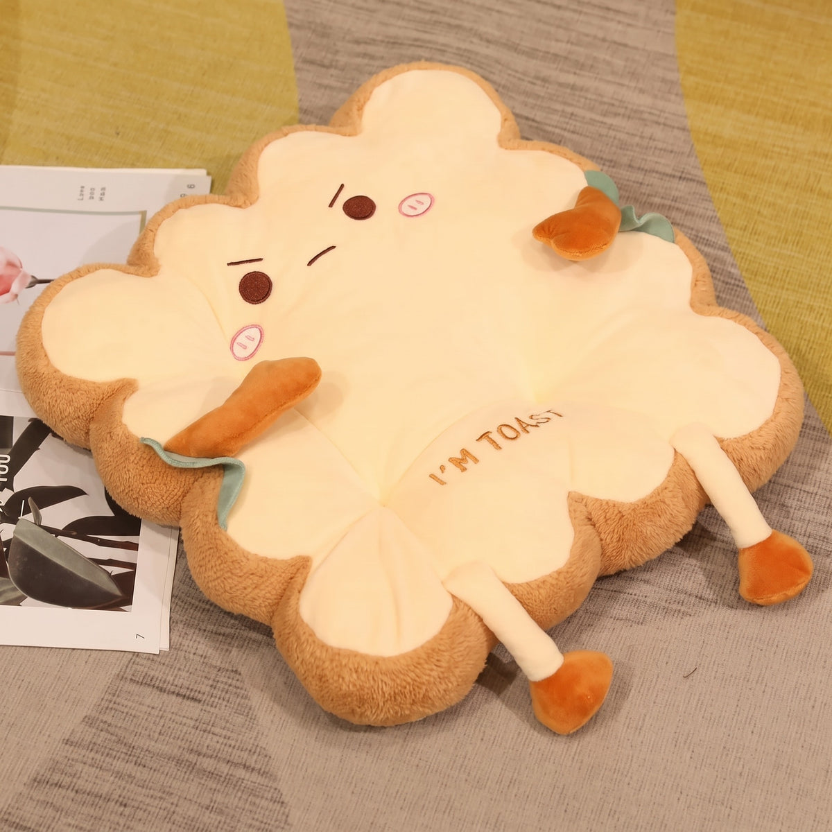 Toast Seat Cushion, Grumpy face with furrowed brows, lying on a rug